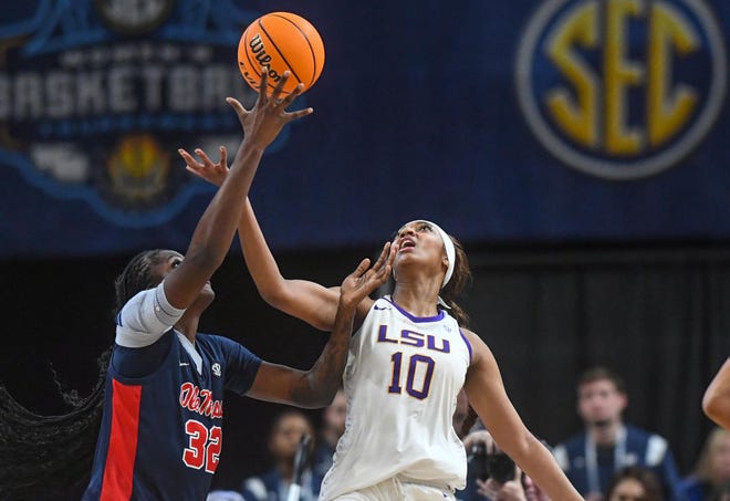 Ole Miss center Rita Igbokwe (32) and Louisiana State University forward Angel Reese (10) reach for a rebound during the fourth quarter of the SEC Women's Basketball Tournament game at the Bon Secours Wellness Arena in Greenville, S.C. Saturday, March 9, 2024.