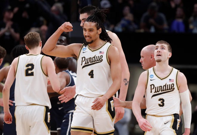 Purdue Boilermakers forward Trey Kaufman-Renn (4) reacts after scoring during NCAA Men’s Basketball Tournament game against the Utah State Aggies, Sunday, March 24, 2024, at Gainbridge Fieldhouse in Indianapolis.