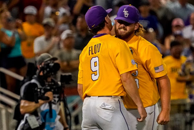 Jun 24, 2023; Omaha, NE, USA; LSU Tigers pitcher Riley Cooper (38) and starting pitcher Ty Floyd (9) celebrate after defeating the Florida Gators in the eleventh inning at Charles Schwab Field Omaha. Mandatory Credit: Dylan Widger-USA TODAY Sports