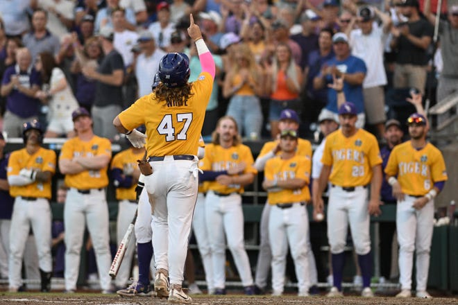 Jun 24, 2023; Omaha, NE, USA;  LSU Tigers third baseman Tommy White (47) signals to the sky after hitting a home run against the Florida Gators in the eighth inning at Charles Schwab Field Omaha. Mandatory Credit: Steven Branscombe-USA TODAY Sports